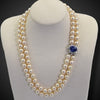 Parelcollier met slot met saffier en diamanten