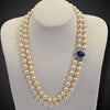 Parelcollier met slot met saffier en diamanten
