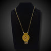 Artistic gold necklace with sun and moon