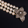 Drierijig parelcollier met diamanten slot