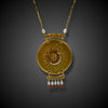 Artistic gold necklace with sun and moon