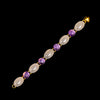 Gold bracelet with cabochon cut amethyst and chalcedony