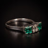 White gold ring with emeralds and diamond