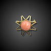 Vintage gold brooch in the shape of a sun