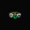 Three-stone gold ring with emerald and diamond